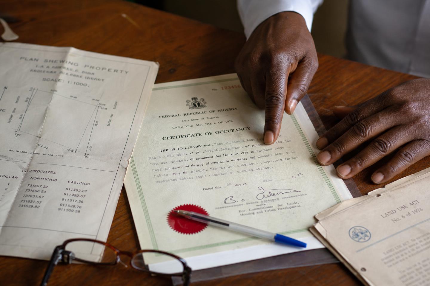Lawyer reviewing Nigerian property title documents